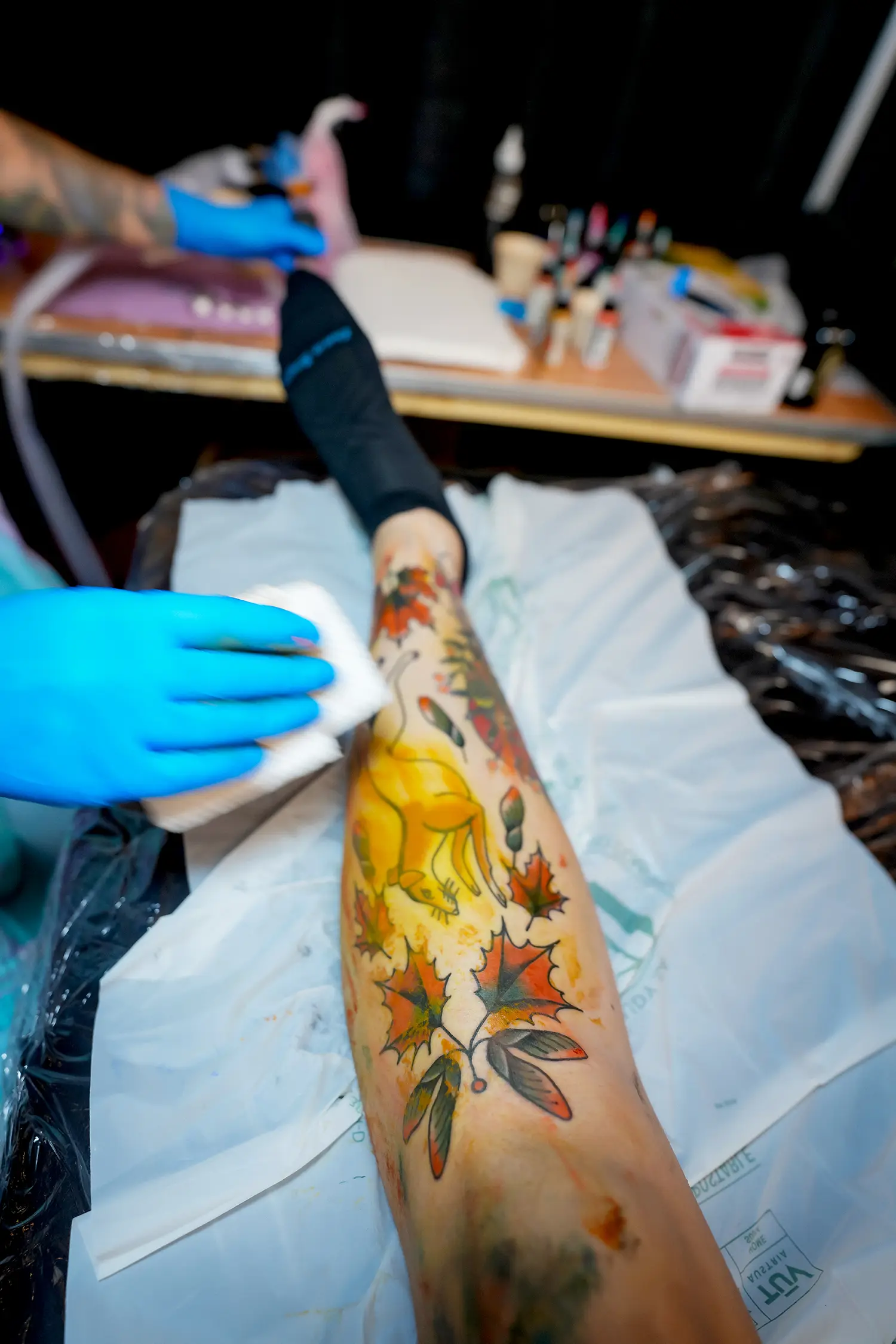 Leonie New works on a leg tattoo. She is the founder of Forest Creek Tattoo in Castlemaine, Victoria, Australia