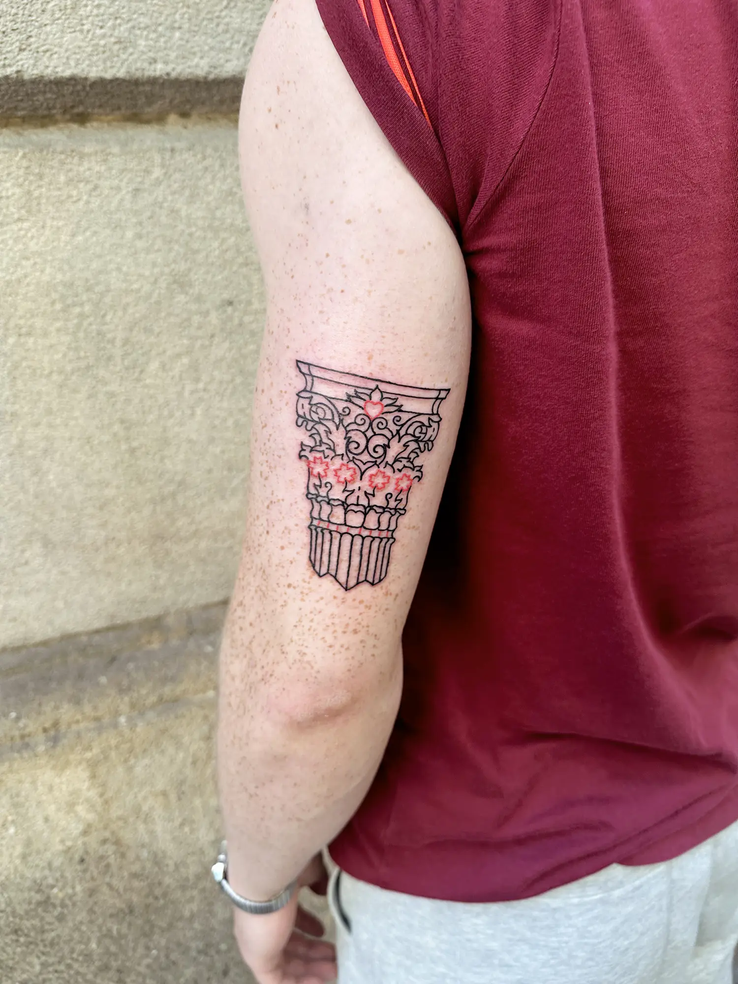 column tattoo on arm. Of the three classical orders that originated in ancient Greece, the most ornamental is the Corinthian column