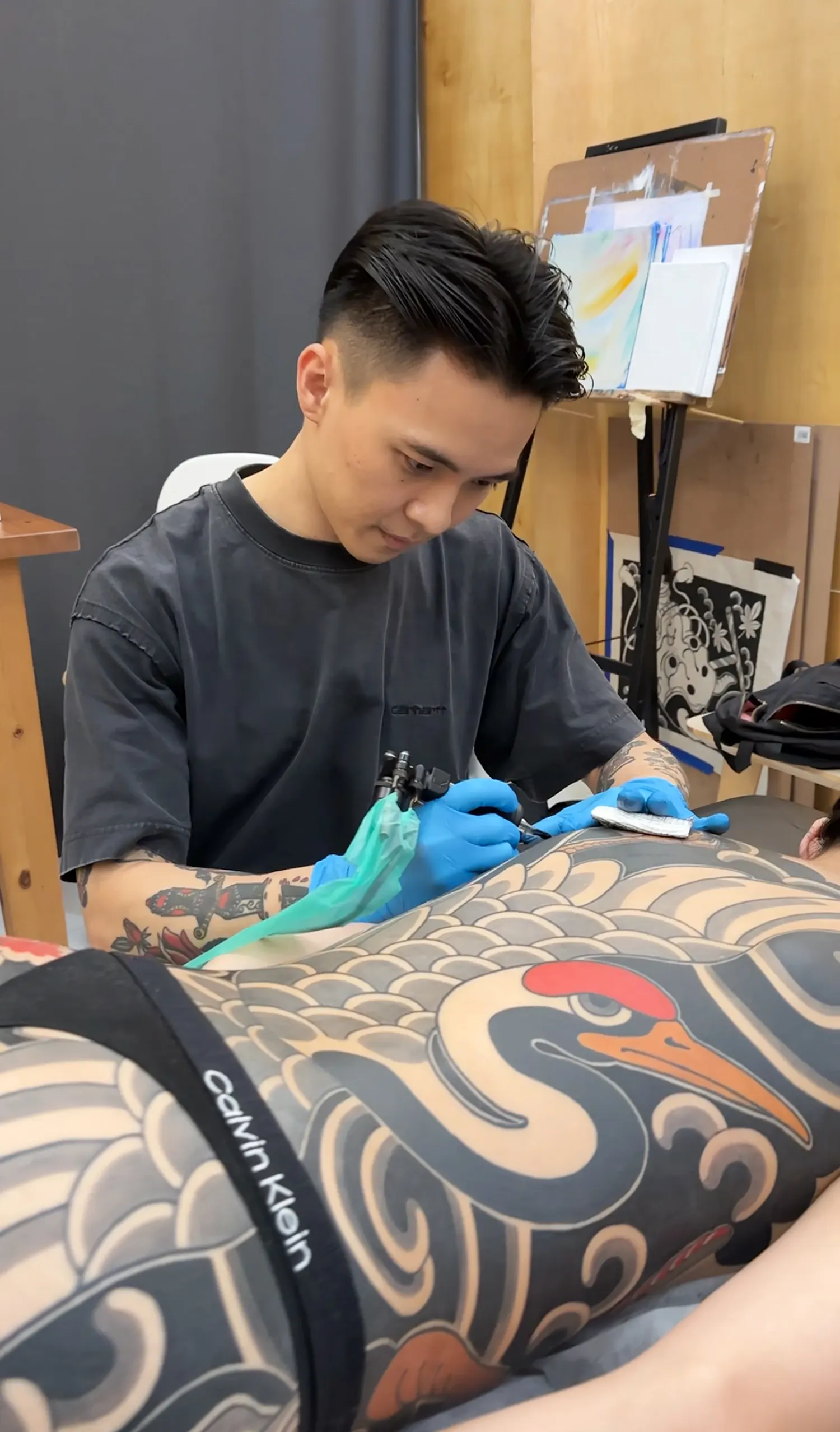 Singaporean tattooer Goodmorning in his private studio