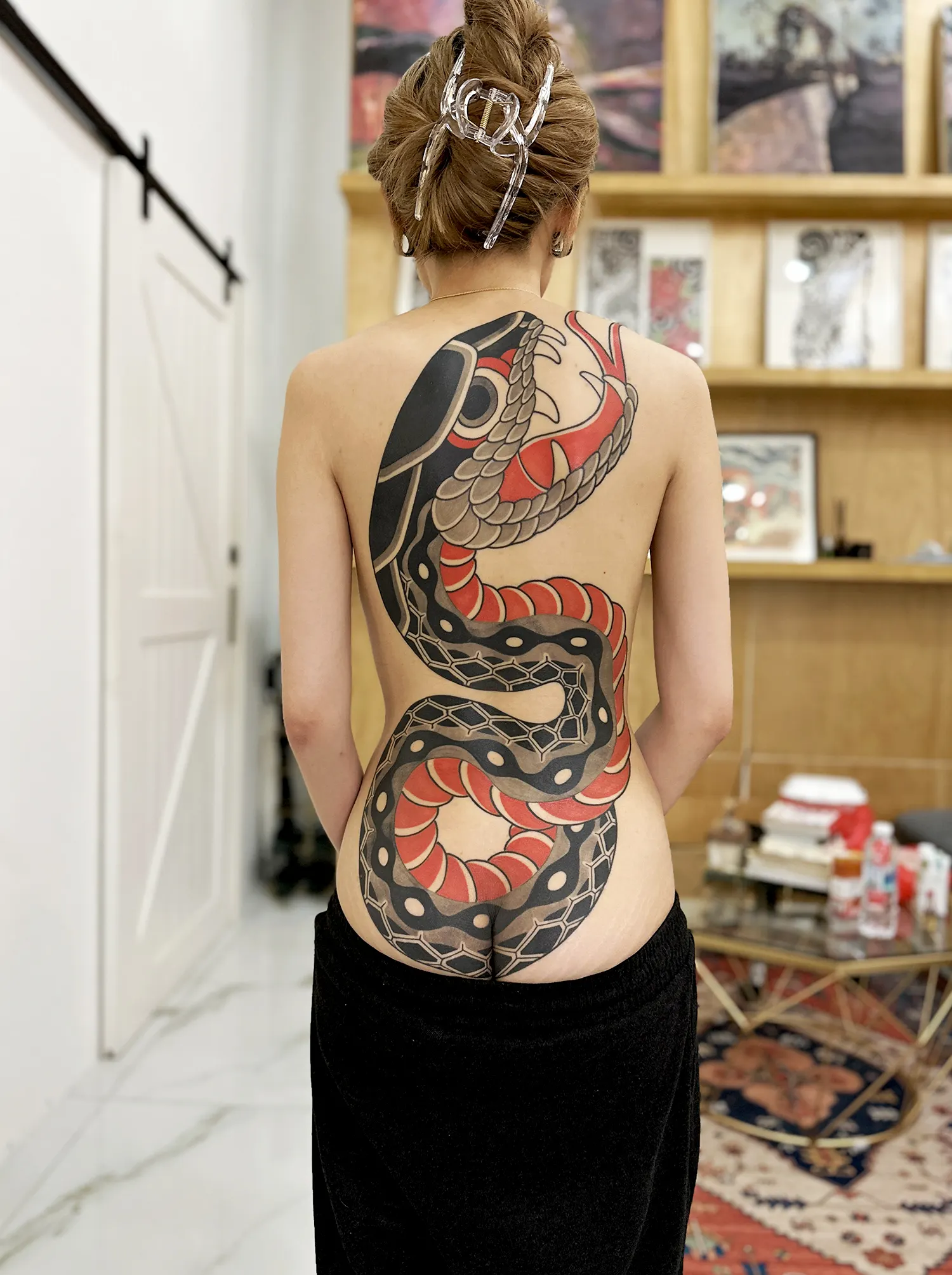 A snake, Hebi, representing protection, renewal, wisdom, and the dual aspects of threat and guardianship