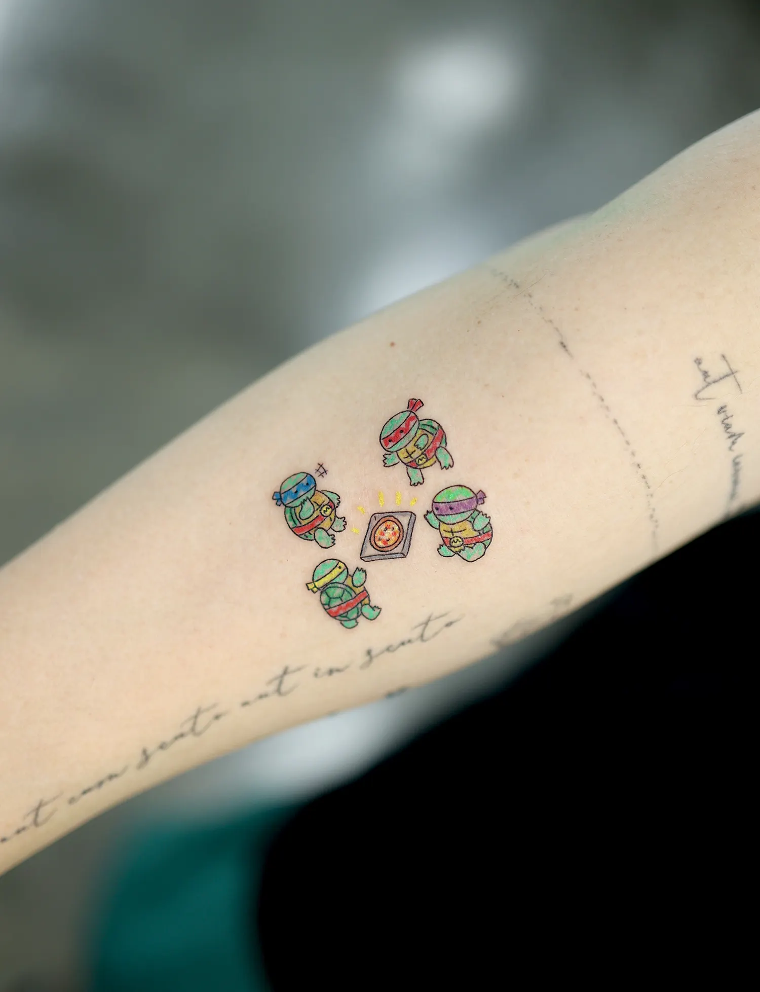 baby ninja turtles tattoo with pizza