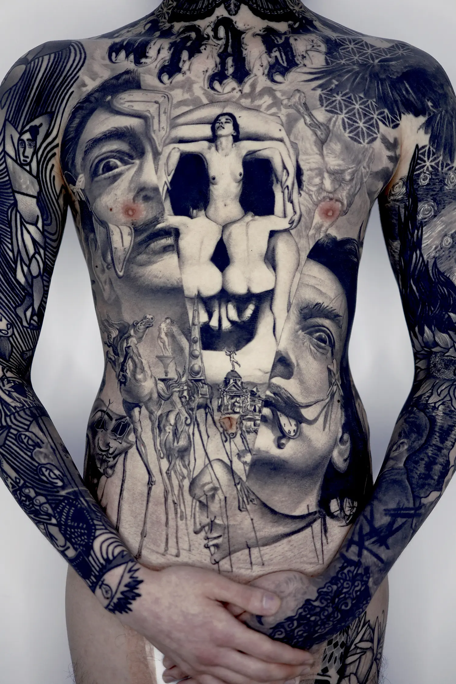 salvador dali back tattoo, his self-portrait and horses and melted watches