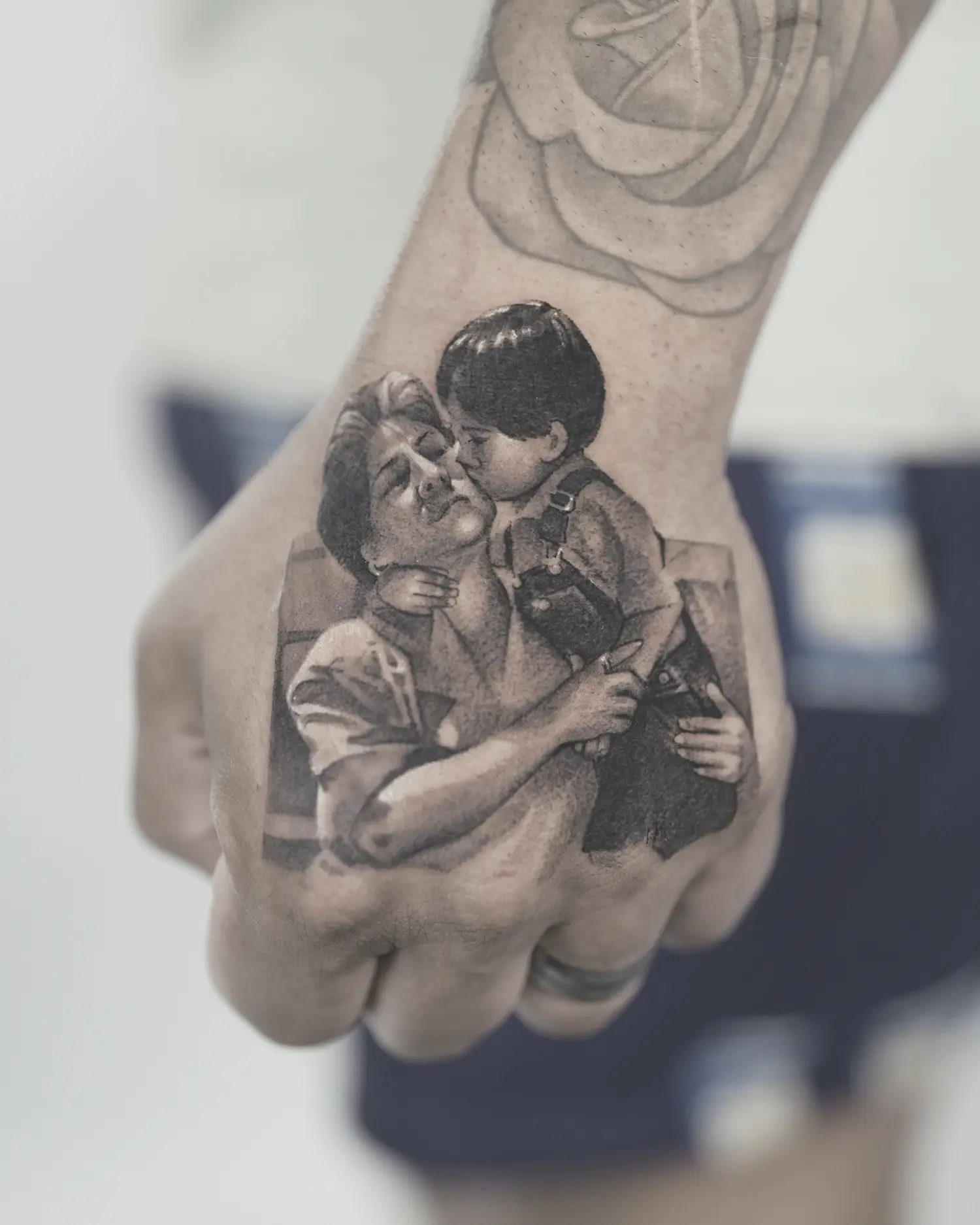 portrait tattoo on hand, family in black and gray by bk