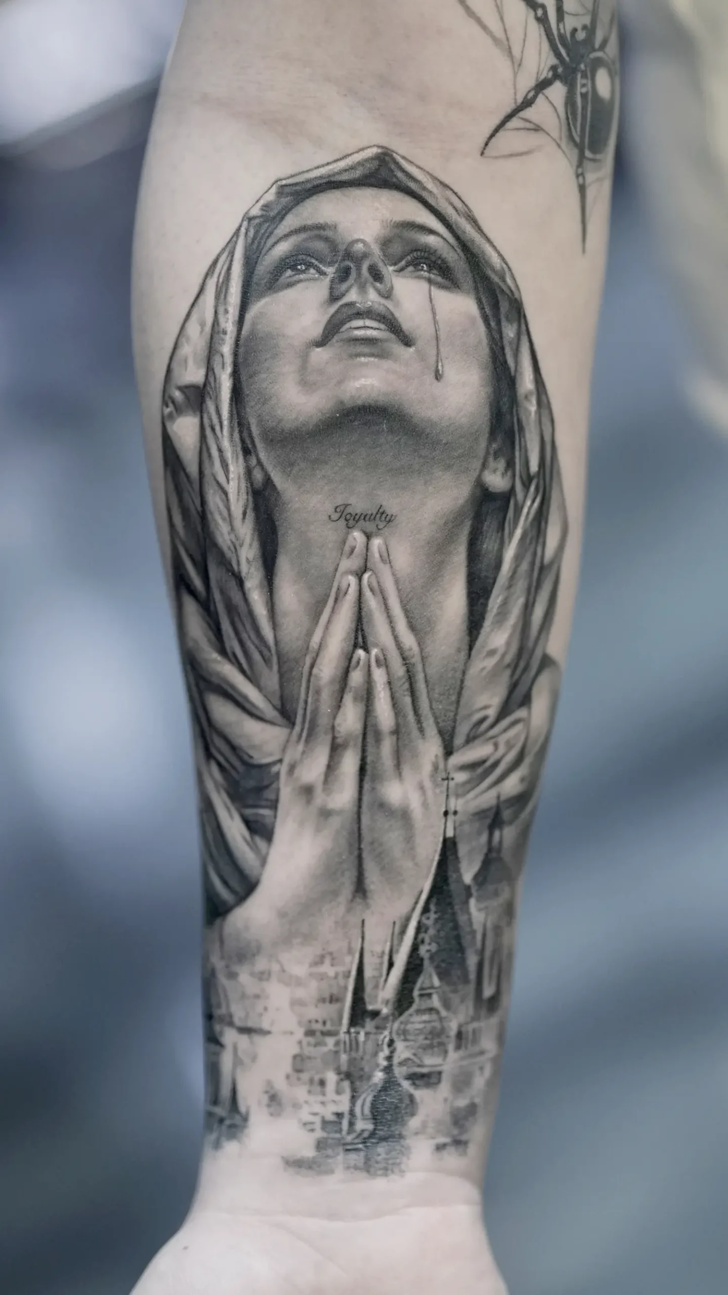 saint tattoo, praying in black and gray
