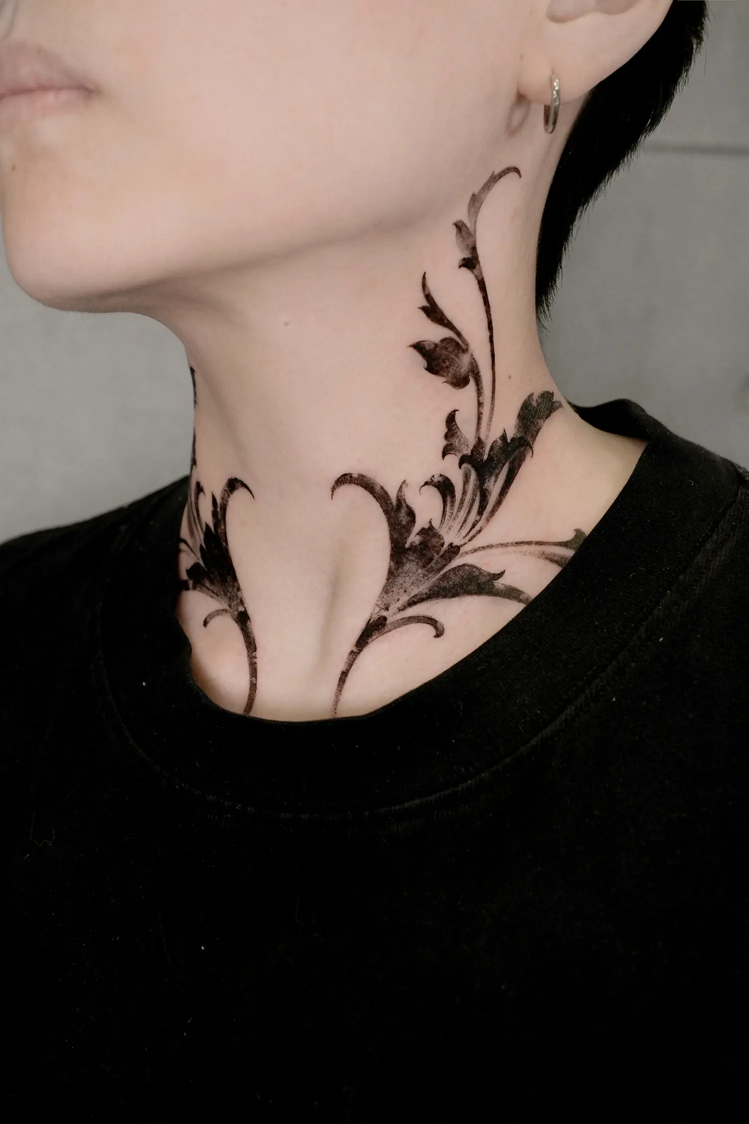 This traditional Chinese scroll grass pattern, featuring flowing vines on the client neck, symbolizes an eternal prosperous life journey