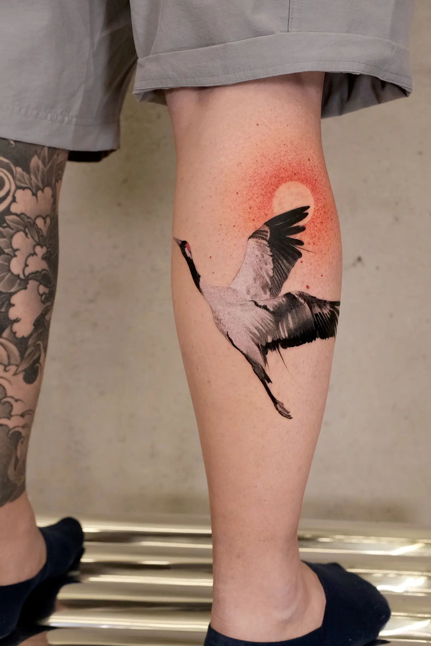 A spiritually liberating and gracefully soaring crane rendered in an ink-wash form