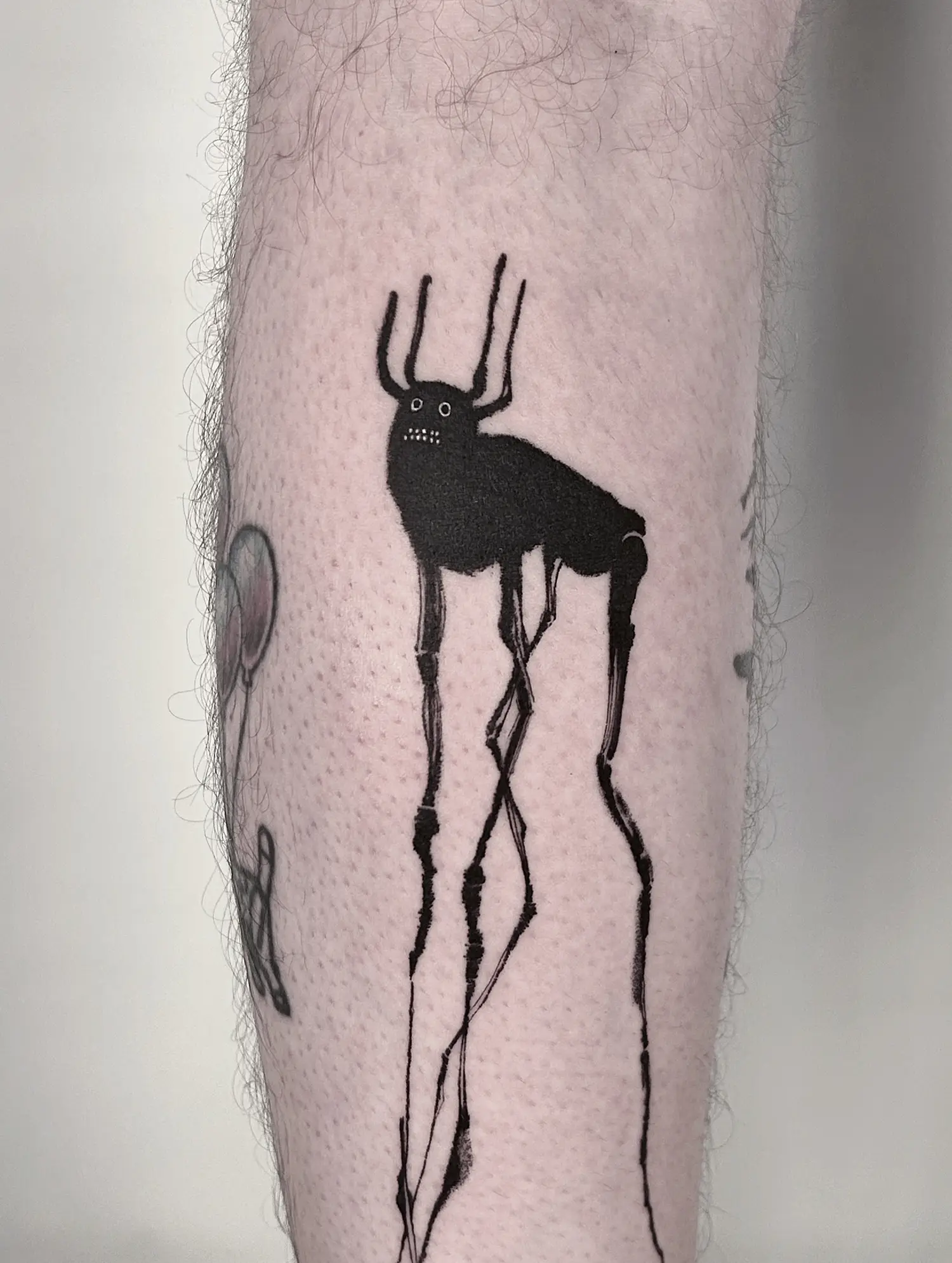 Stylized deer character, black ink with white highlights, tattoo by avenn