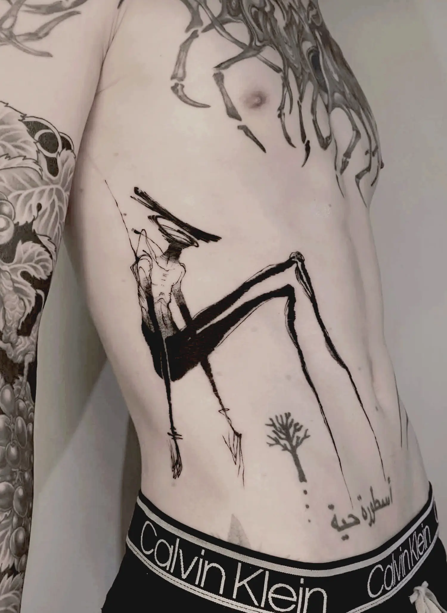 hammerhead shaped head with human body, stretched thin legs, a tattoo called pensive by avenn